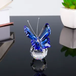 Crystal blue butterfly figurine detail, faceted crystal ball base, elegant desktop decor.