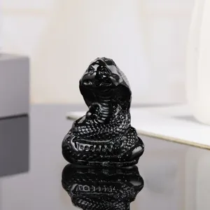 Detailed view of black crystal snake ornament, Chinese zodiac animal figurine for home decor.