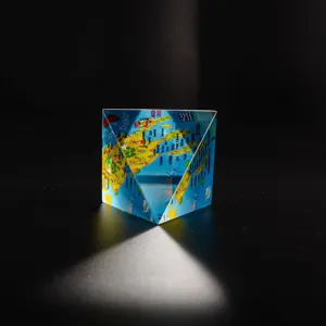 Crystal glass triangular prism souvenir paperweight featuring map and geographic landmarks design.