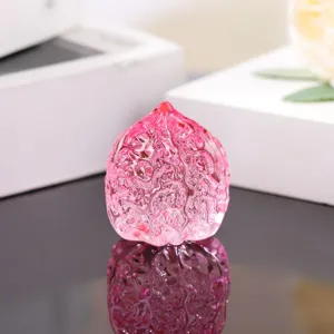 Pink glass walnut figurine hand play piece crystal ornament for desk decoration and gift.