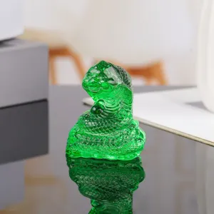 Green crystal snake figurine detail, zodiac animal crystal sculpture close up, home decor