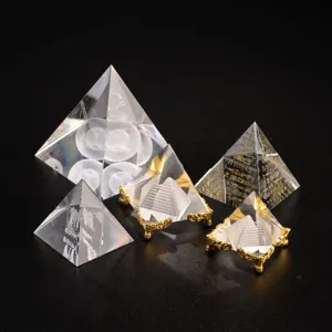 Crystal pyramid ornaments detail showing various designs and clear inner carvings with bases.
