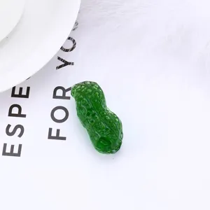 Detailed shot of green crystal peanut ornament, exquisite tabletop decoration for home.