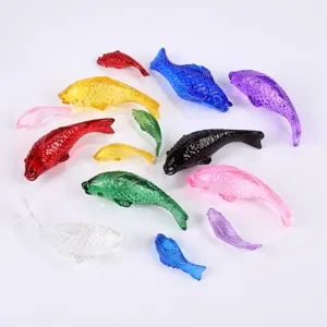 Colorful glass fish figurines set, assorted crystal fish for home tabletop decor.