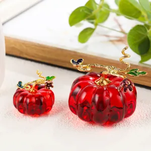 Red crystal pumpkin detail shot, exquisite gold vine ornament, perfect for home desktop decor.