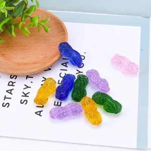 Crystal peanut figurines detail view, colorful glass ornaments for home decor and desktop display.