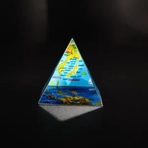 Crystal pyramid ornament souvenir with map print, clear glass geometric desk decor piece.
