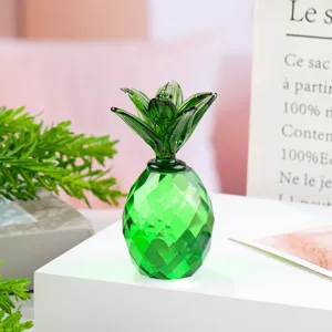 Close-up detail of a vibrant green crystal pineapple figurine, elegant desktop decor ornament.