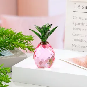 Close-up detail of a pink and green crystal pineapple figurine, perfect for modern desktop decor.