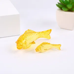 Crystal glass fish figurine set, transparent yellow decorative ornament for home desktop display.