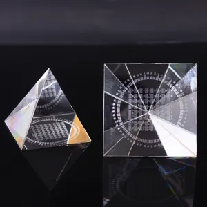 Crystal pyramid detail shot showing fine laser engraved I Ching Bagua patterns and symbols.