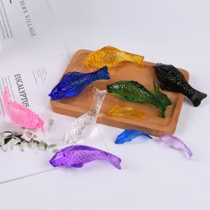 Colorful glass fish figurines set, decorative crystal ornaments for home decor and tabletop.