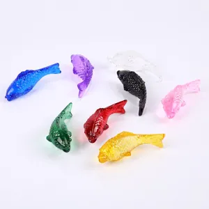 Colorful crystal glass fish figurines, vibrant multi-color small animal ornaments for home decor.