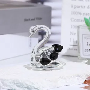 Exquisite crystal swan figurine, detailed close-up showing sparkling facets and elegant design.