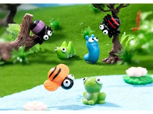 Detailed view of miniature resin insect and animal figurines for moss landscape and DIY decor.