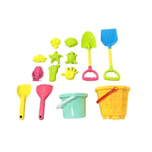 Children beach sand toys set with buckets shovels and molds for outdoor play.