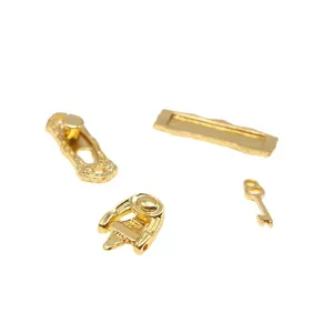 Miniature dollhouse metal hardware set including vintage lock, mailbox plate and tiny key.