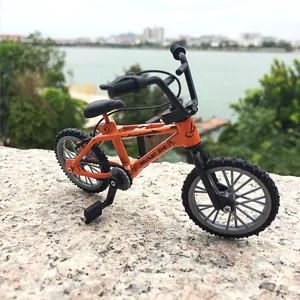 Mini alloy finger BMX bike model, orange miniature bicycle toy with realistic details.