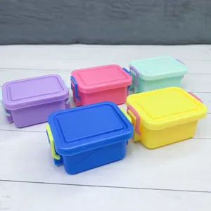 Miniature dollhouse storage box detail, colorful plastic containers for DIY pretend play.
