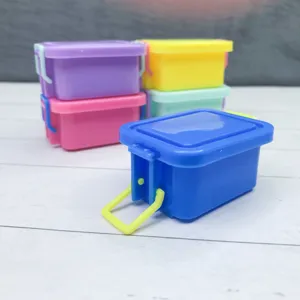 Miniature plastic storage box detail, colorful dollhouse prop and DIY tiny container closeup.