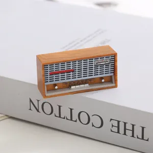 Detailed close-up product view of a miniature 1:12 scale dollhouse vintage radio model prop.
