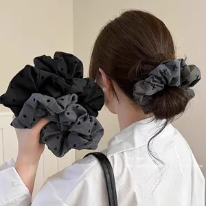 Chic bow and dot patterned hair scrunchie for women, elegant daily hair styling accessory.