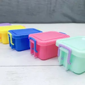 Colorful miniature plastic storage boxes set for dollhouse play house and simulation scene.