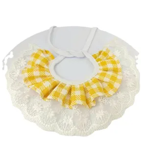 Yellow and white plaid pet bib with delicate white lace ruffles and elastic strap for cats.
