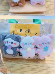 Cute plush blush cat keychain for backpacks, soft animal doll bag pendant for students.
