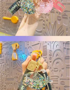 Detailed view of the cute liquid-filled glitter whale keychain accessory with strap.