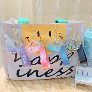 Cute cartoon liquid glitter whale keychain with strap charm, lovely bag pendant accessory.