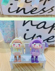 Cute cartoon girl keychain electroplated toy bag pendant accessory for stylish couples.