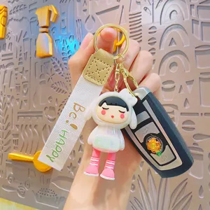 Handheld cute cartoon girl keychain with electroplated metal ring and fabric strap main view.