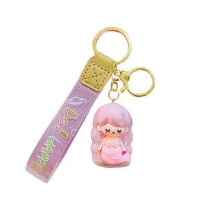 Cute mermaid keychain with purple strap, glittering pink pendant, stylish bag charm.