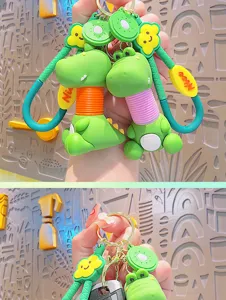 Cute telescopic dinosaur keychain with fruit pendant, cartoon bag charm and car key ring accessory.