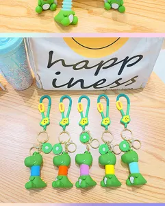 Cute cartoon dinosaur keychain with telescopic accordion neck and fruit pendant for bags keys.