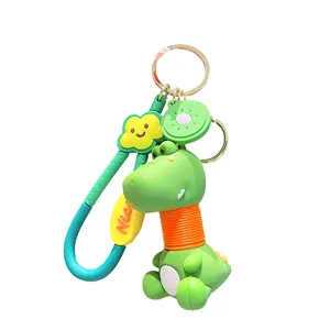 Cute cartoon dinosaur keychain with kiwi fruit accessory, lovely bag charm and car key ring.