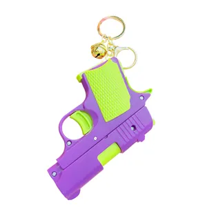Portachiavi pistola ravanello in plastica viola verde creativo giocattolo con campanello.