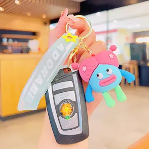 Cute cartoon girl car keychain with silicone doll pendant and stylish strap accessory for women