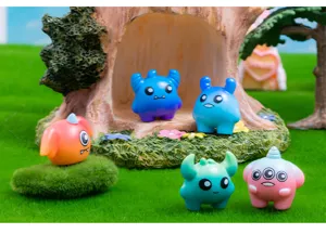 Detailed view of cute resin monster figurines, micro landscape desktop car decor charms.