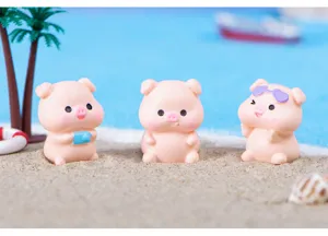 Detailed view of cute resin beach vacation little pig figurine micro landscape toy.