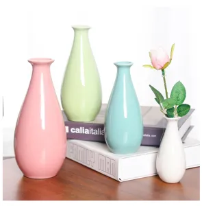 Set of 4 mini ceramic vases in pastel colors, perfect for home decor and hydroponic plant display.