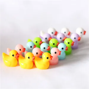 Mini resin duck figurine detail shot, colorful candy-colored miniature ornaments for DIY crafts.