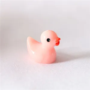 Close-up of a cute pink resin duck figurine, perfect for micro landscape and DIY phone case.