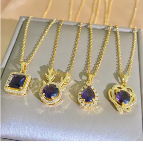 Detailed view of four exquisite gold-plated titanium steel necklaces with purple stones.