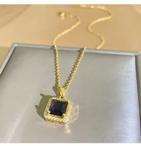 Close-up detail of exquisite titanium steel necklace featuring a purple zircon pendant with paved stones.