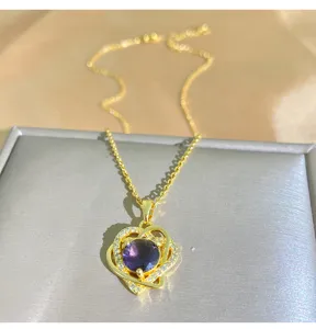 Exquisite detail of the purple zircon double heart necklace, showcasing sparkling crystals.