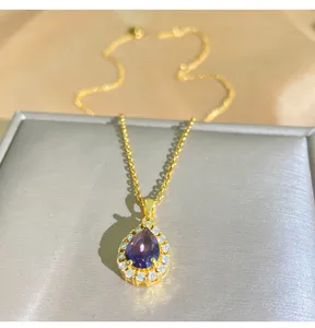 Close-up shot of the exquisite purple pear zircon pendant necklace showcasing delicate halo design.