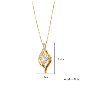 Detailed close-up shot of the gold geometric pendant necklace with sparkling zircons.