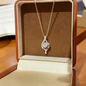 Elegant silver geometric zircon pendant necklace displayed in a box, versatile accessory for women.